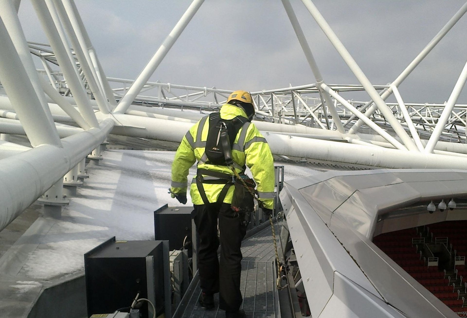 Worker at stadium roof