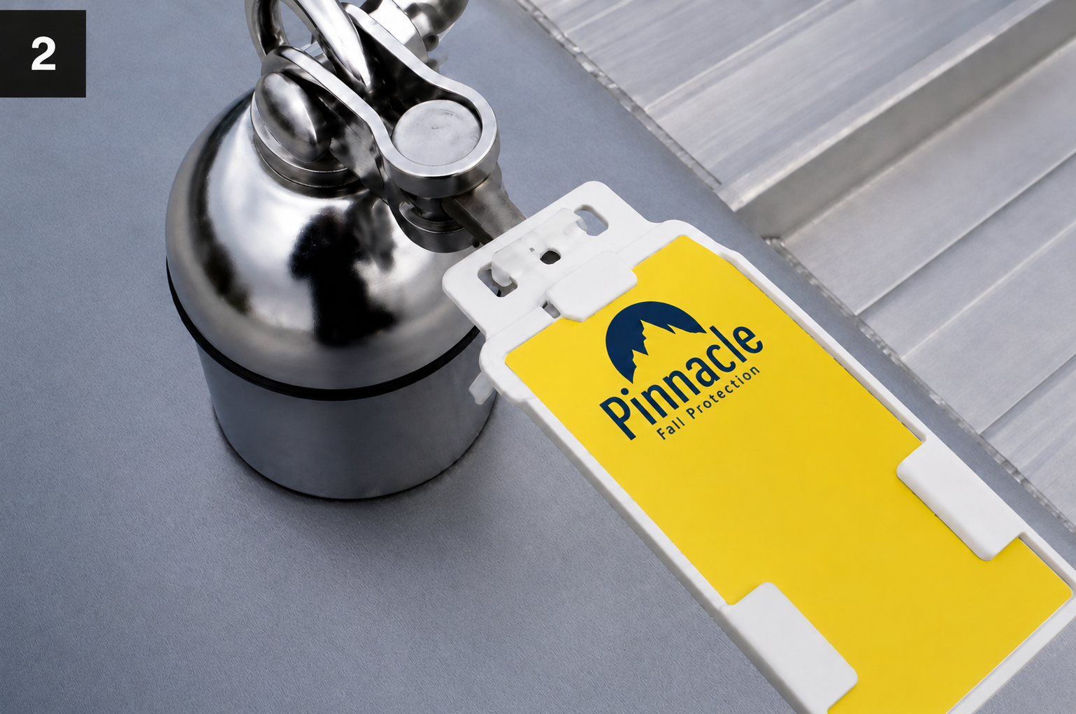 Pinnacle Fall Protection certification tag attached to eyebolt anchor